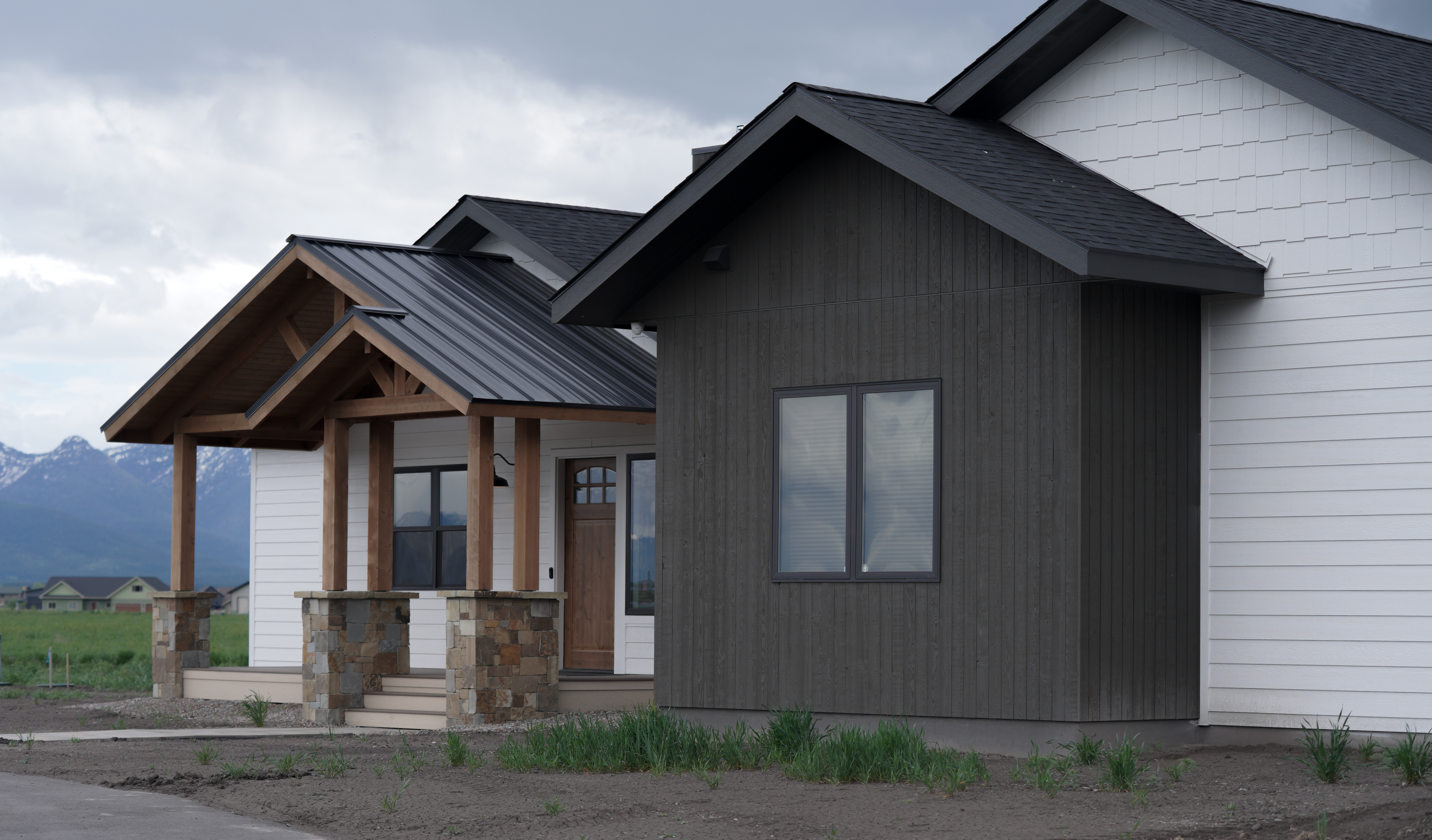 High-end custom home builder in Kalispell installing windows